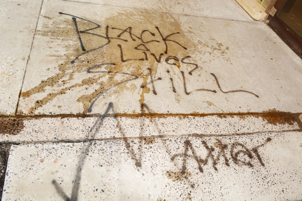 The graffiti outside of the Lane University Center after a student poured his drink on the message. (TBL/Nick DeMichele)