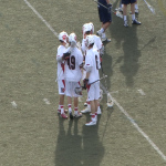 Players celebrate after Rolland's first goal of the game. (Brad Kroner)