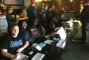 Brothers of Alpha Phi Omega helping with registration 