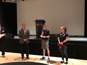 Cody Bowers and Vanessa Robinson of Student Veterans of American presenting Sergeant Major Preston with a small gift. (TBL/Nicole Leighty)