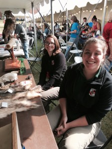 Two naturalists from Rocky Gap State Park, Megan Manes (left) and Paige Vance (right) hosting their informative booth. 