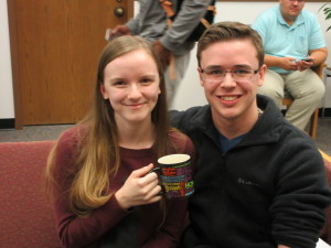 Tiffany Gulick and Daniel Steel celebrate their raffle win of the banned books mug.