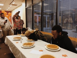 The three contestants competing in the pumpkin pie eating contest. Photo credit: Torie Costa