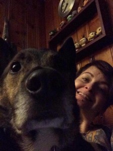 Small poses for a selfie with her dog.