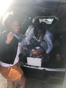 The National Council of Negro Women's Chapter members unloading Thanksgiving baskets. | Source: Lyric Mitchell