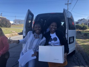 The National Council of Negro Women's Chapter members unloading Thanksgiving baskets. | Source: Lyric Mitchell